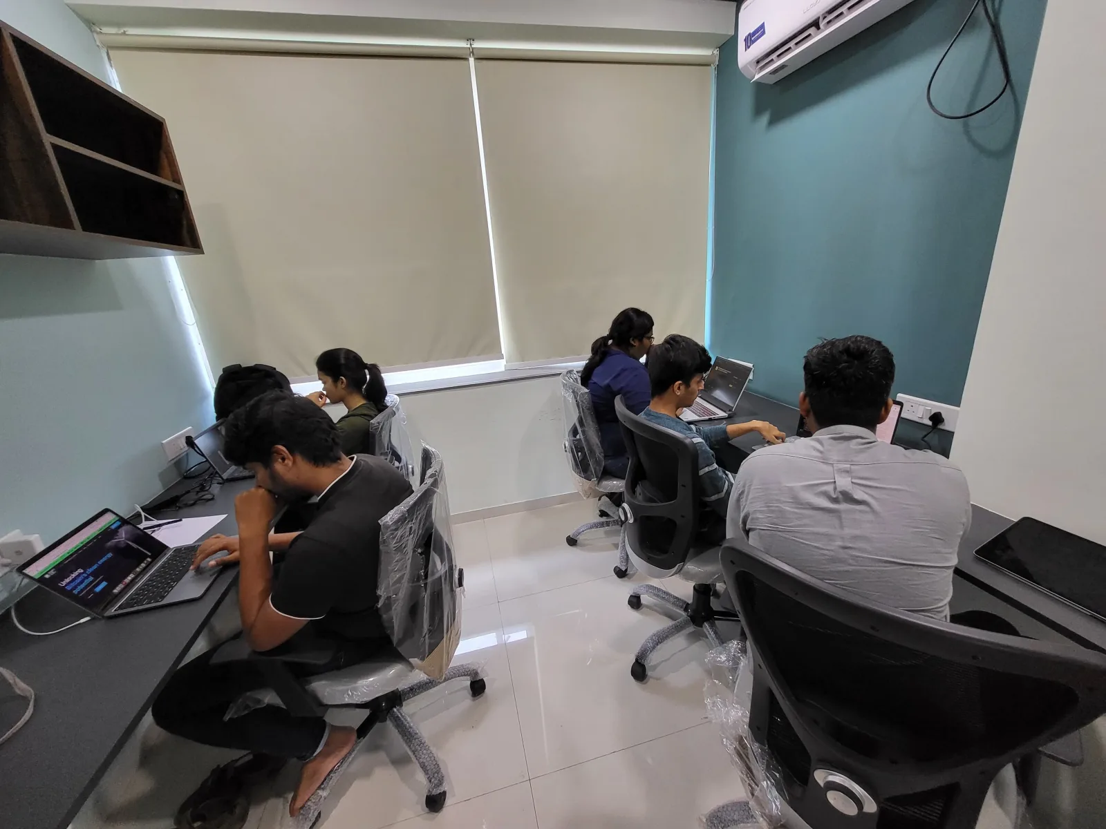 Website Vikreta team working at their office workspace
